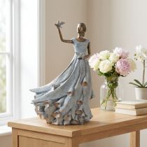 Product Figurine of a woman with a bird. Artfully designed decorative sculpture for timeless design. 41cm