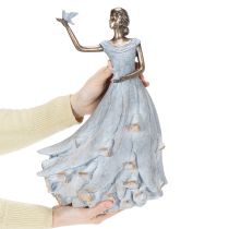 Product Figurine of a woman with a bird. Artfully designed decorative sculpture for timeless design. 41cm
