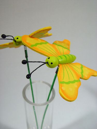 Floristik24 Butterfly on pick green / yellow wood 7cm (24pcs)