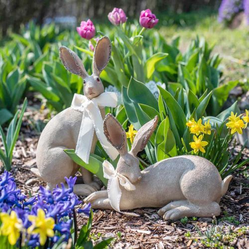Floristik24 Easter bunny lying with bow Polyresin Easter decoration 28cm
