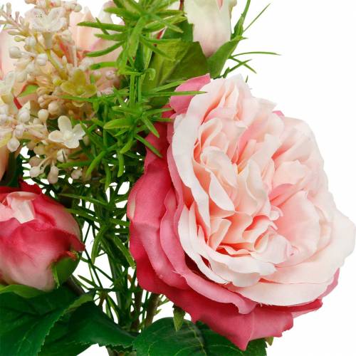 Bouquet of artificial roses in a bunch of pink silk flowers bouquet