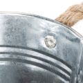Glossy metal bucket with rope