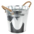 Glossy metal bucket with rope
