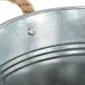 Glossy metal bucket with rope